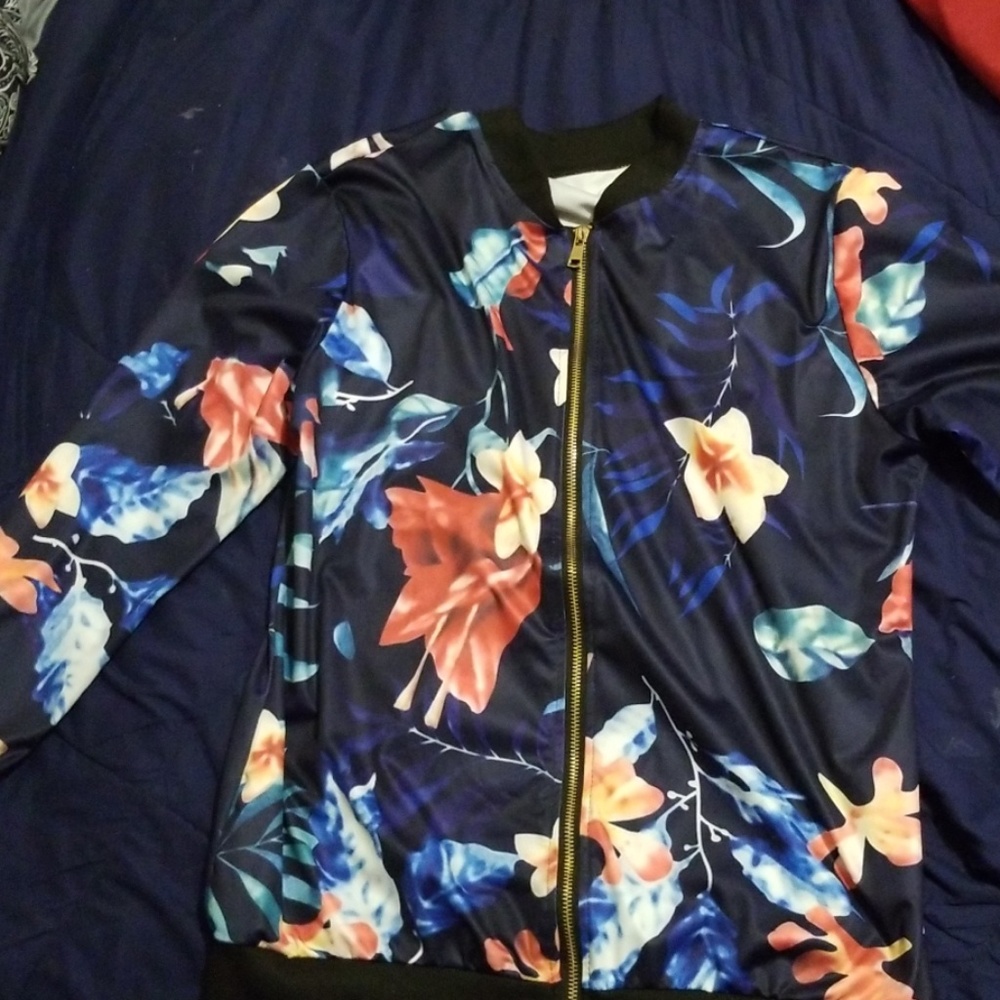 A navy blue flowered bomber jacket